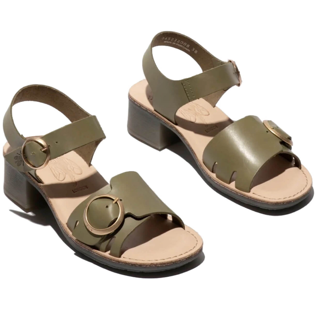 A pair of olive green leather block-heel sandals with wide straps, circular cutout details, and gold-tone buckle hardware, shown on a white background. Sole Drifter